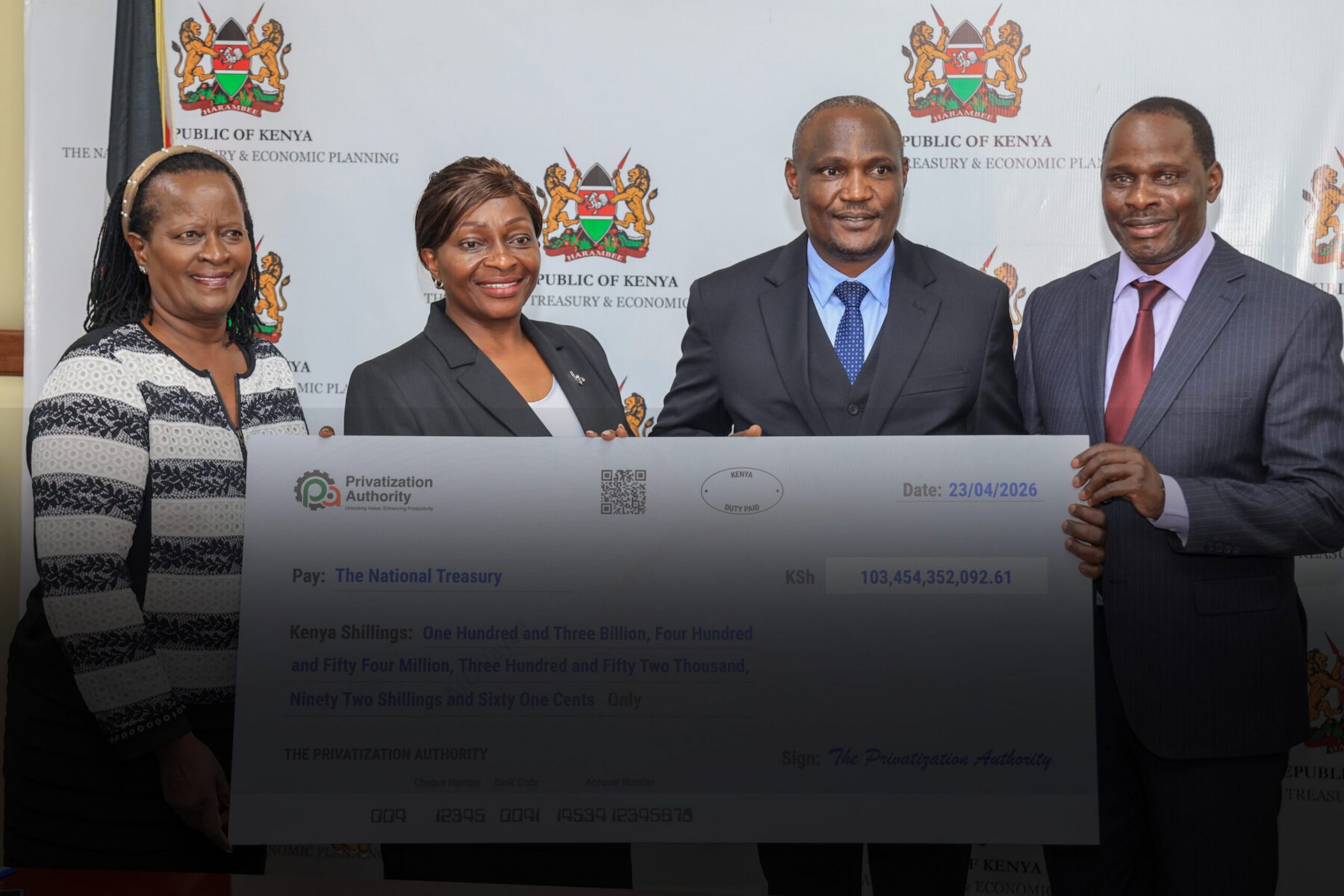 Privatization Authority officials at a cheque handover